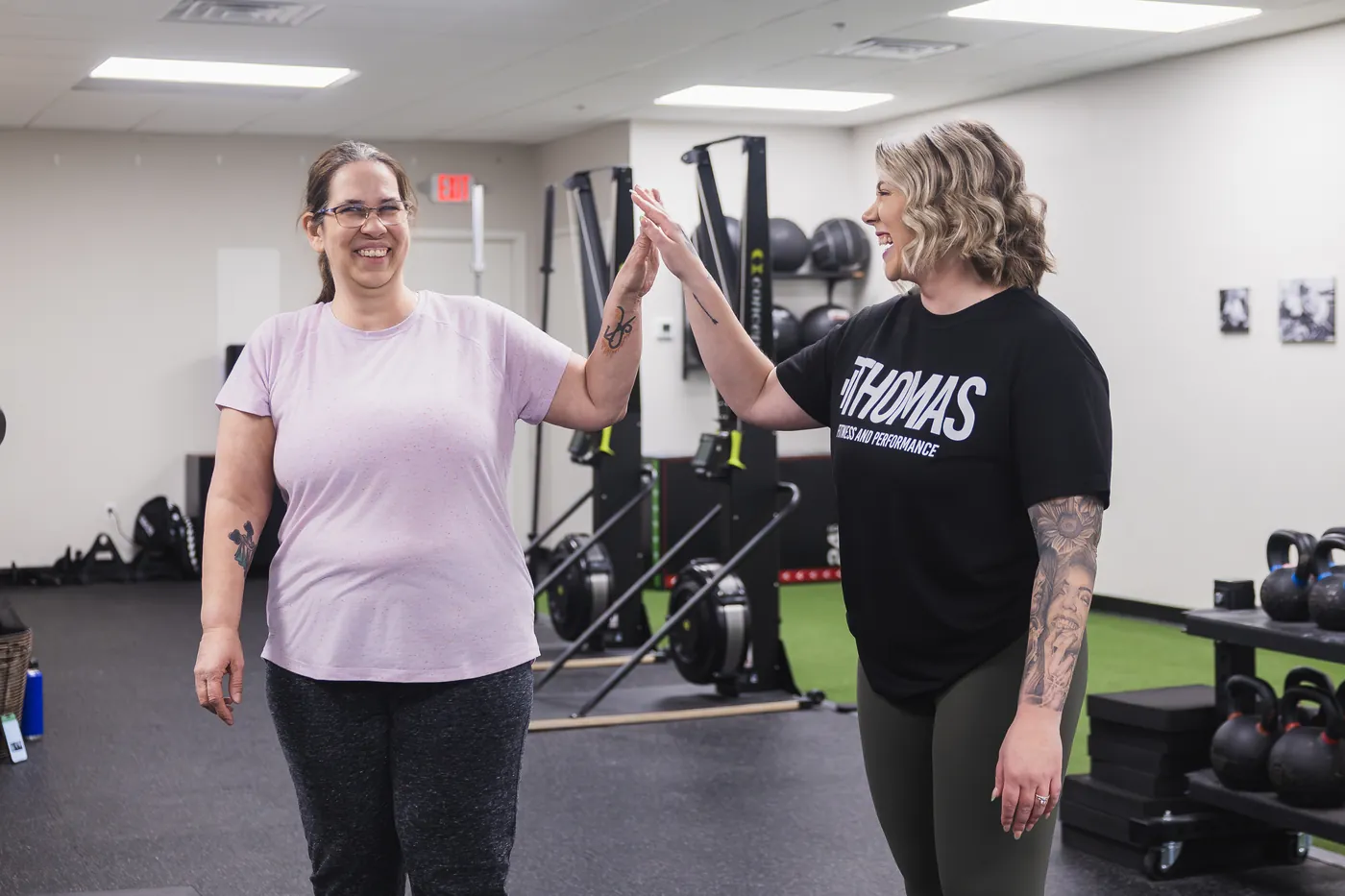 Busy professionals doing progressive resistance training at Thomas Fitness in Farmington CT