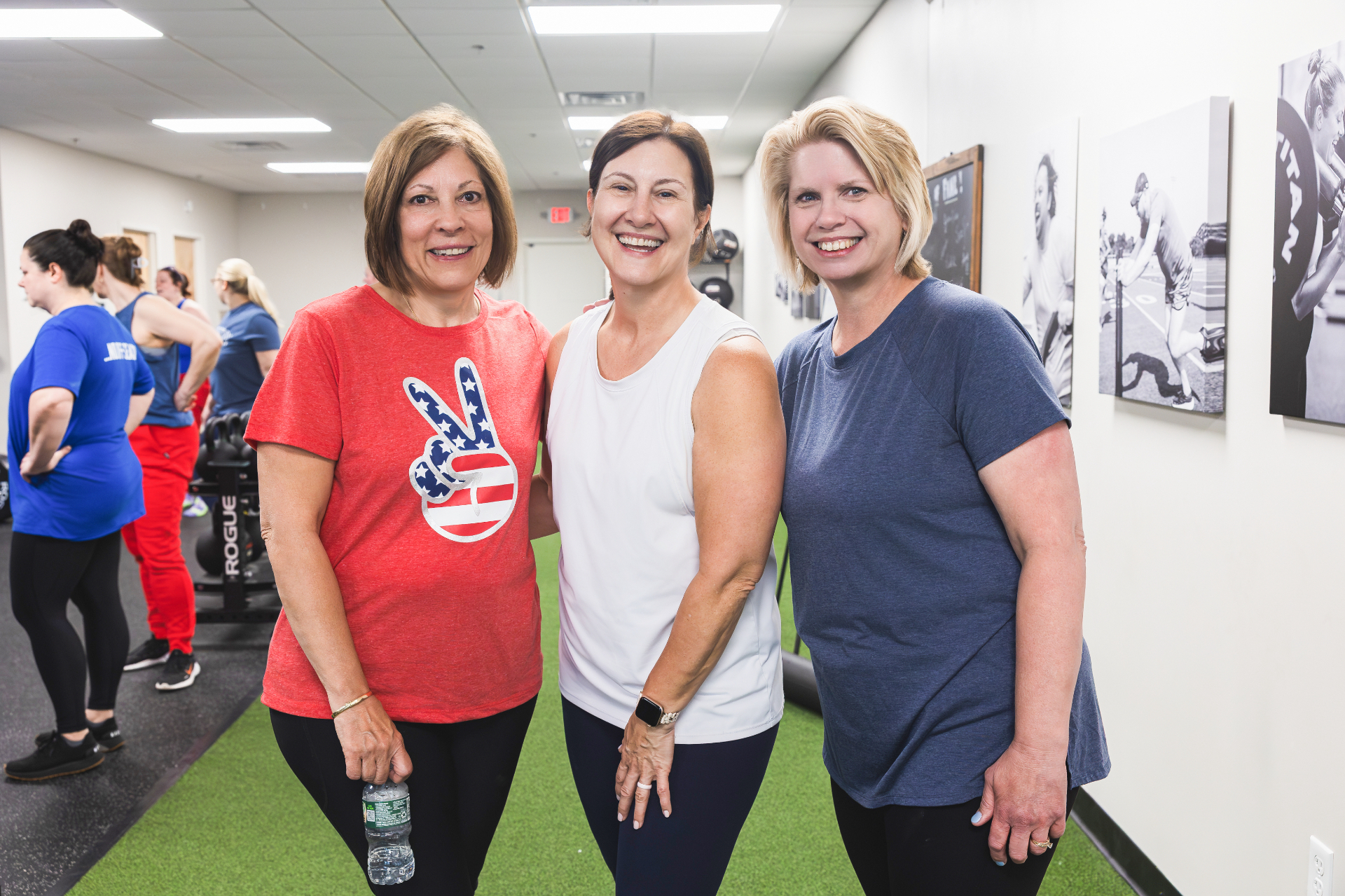 Three smiling members after a small group training class at Thomas Fitness in Farmington CT